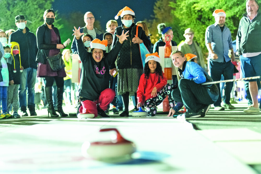 Playing at the snow zone during Light Up Main Street. SIGNAL FILE PHOTO