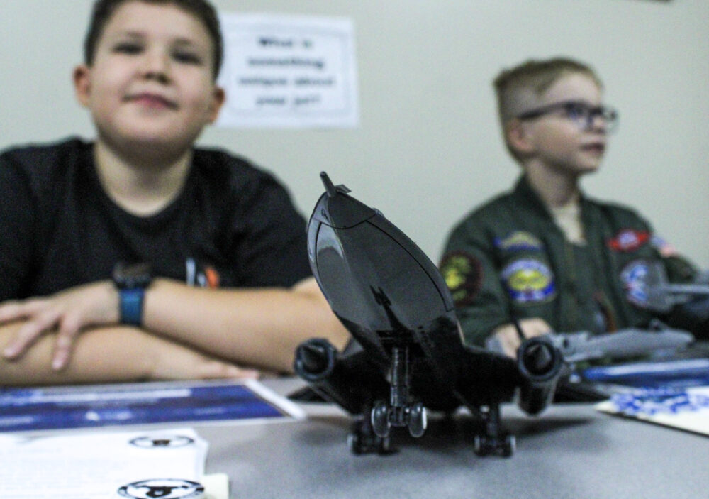 Fourth grader Benny Banuelos, left, and third grader Kooper Kanes sit behind Banuelos' SR-71 Blackbird model at an SCVi open house on Friday, Nov. 14, 2025. Susan Monaghan/The Signal