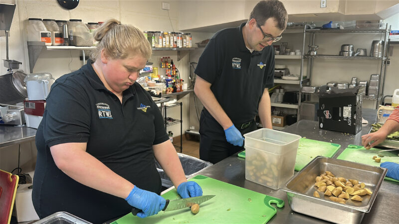 Participants in Carousel Ranch's Ready to Work program prepare vegetables as part of the program's "restaurant experience week." Photo courtesy of Carousel Ranch.