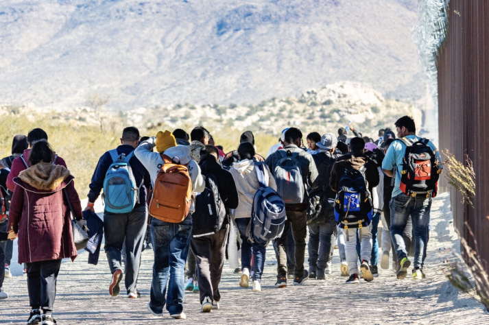 Illegal immigrants await processing by U.S. Border Patrol agents outside of San Diego, Calif., on Dec. 5, 2023. Photo by John Fredricks.