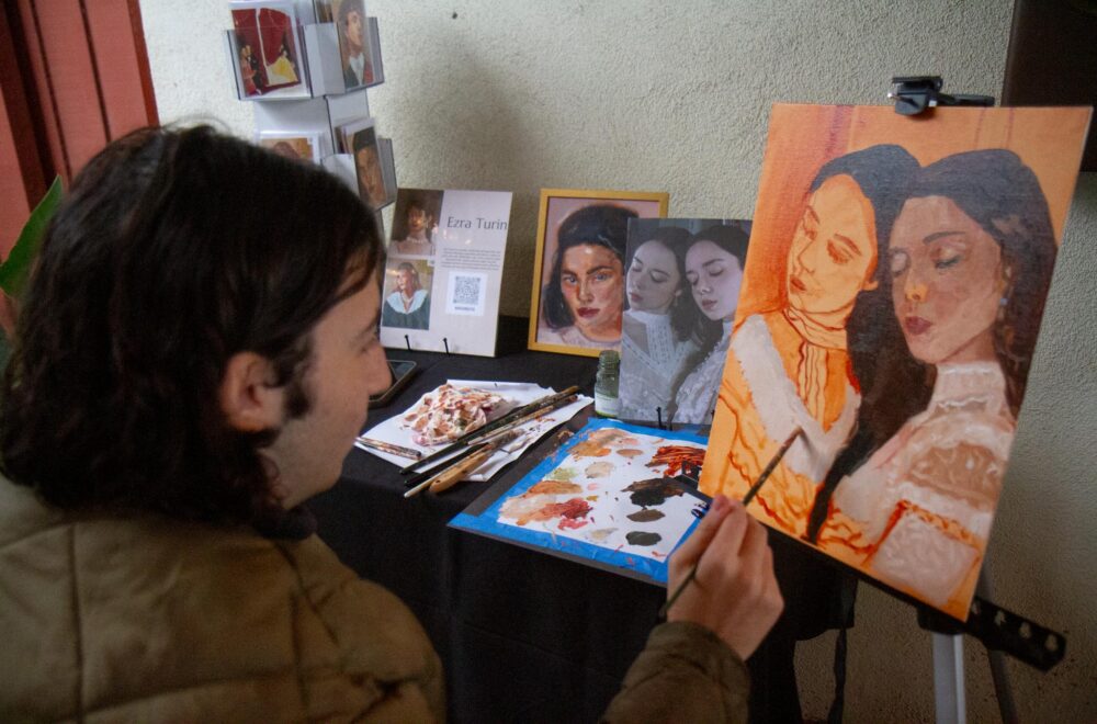 Artist and SCAA member Ezra Turn live paints during The Santa Clarita Artists Association Gallery’s group art schow titled “Reflections” in Newhall on Saturday, Nov. 15, 2025. Katherine Quezada/The Signal