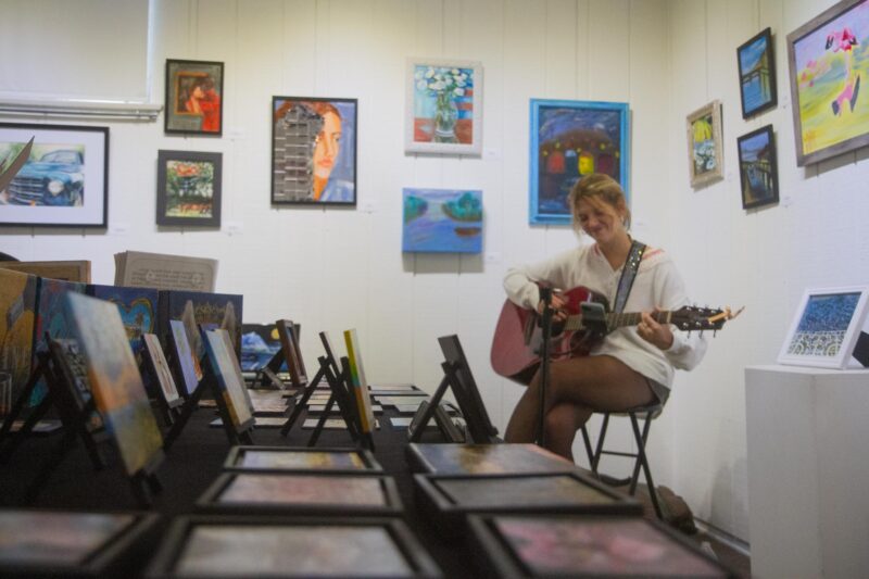 Artist, singer, and songwriter Isabella Bazler performs acoustic songs during The Santa Clarita Artists Association Gallery’s group art schow titled “Reflections” in Newhall on Saturday, Nov. 15, 2025. Katherine Quezada/The Signal