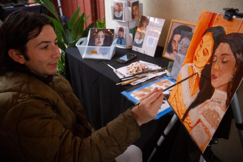 Artist and SCAA member Ezra Turn live paints during The Santa Clarita Artists Association Gallery’s group art schow titled “Reflections” in Newhall on Saturday, Nov. 15, 2025. Katherine Quezada/The Signal