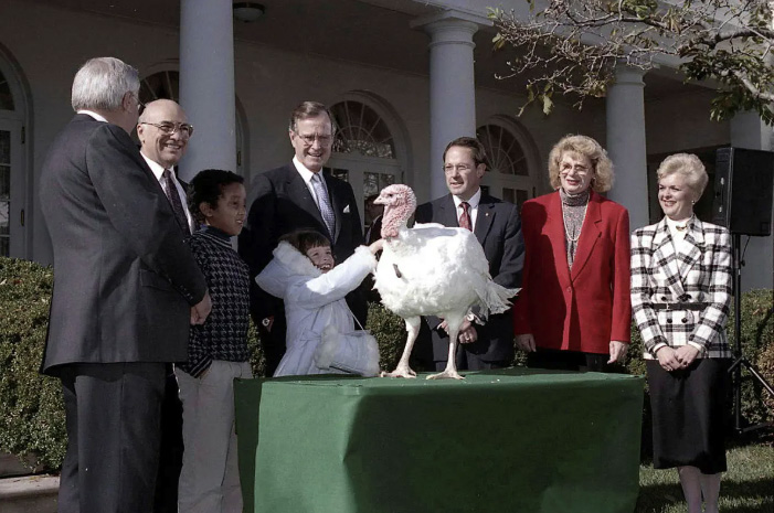 George H.W. Bush pardons a turkey in the Rose Garden at the White House on Nov. 17, 1989. Courtesy George Bush Presidential Library and Museum/NARA