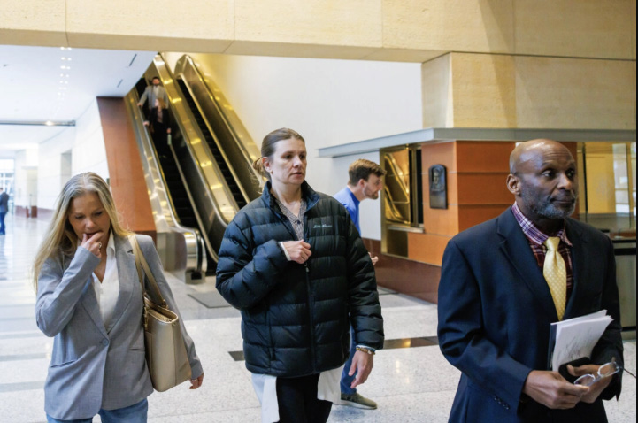 Aimee Bock (C), founder and executive director of the nonprofit organization Feeding Our Future, arrives at the Minneapolis federal courthouse with her attorney, Ken Udoibok (R) in Minneapolis on March 19, 2025. Kerem Yücel/Minnesota Public Radio via AP