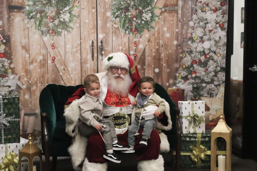 Cole Clark (L), 3, and Maverick Clark (R), 1, get ready for a photo with Santa Clause at the Prosperitas Financial Toys for Tots and Photos with Santa event at Prosperitas Financial in Valencia, Calif., Thursday, Dec. 4, 2025. Kamryn Martell/The Signal