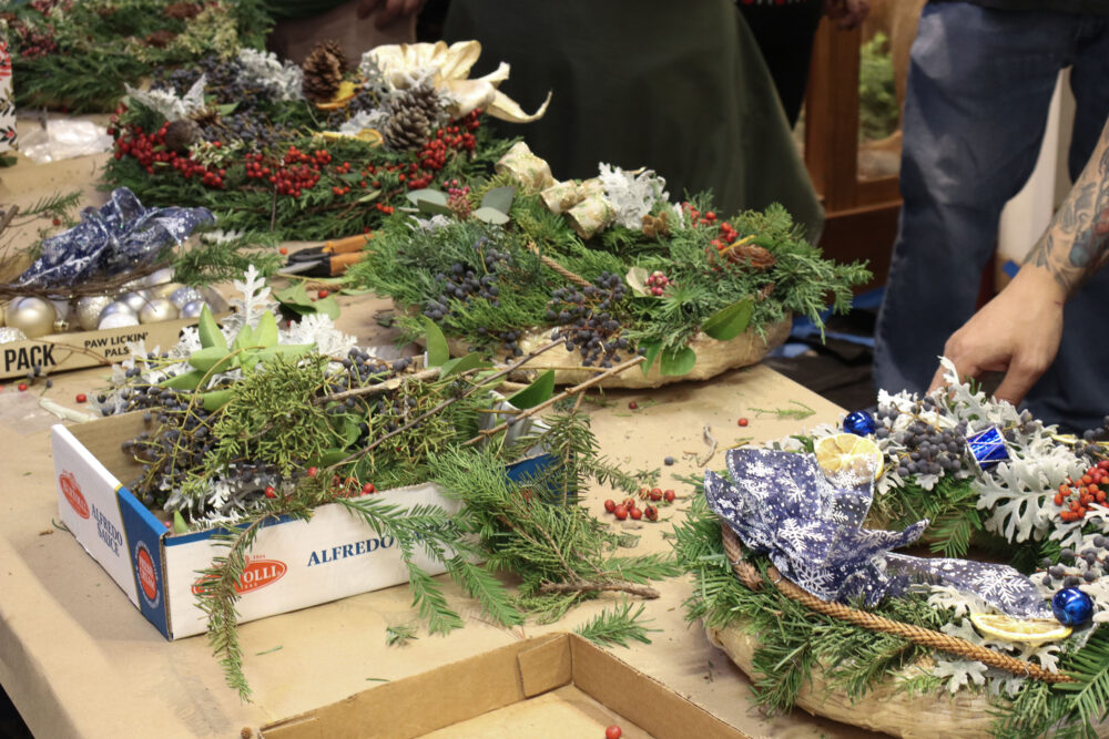 Wreaths get a finishing touch at the Holiday Craft Fair at the Placerita Canyon Nature Center in Newhall, Calif., Sunday, Dec. 7, 2025. Kamryn Martell/The Signal