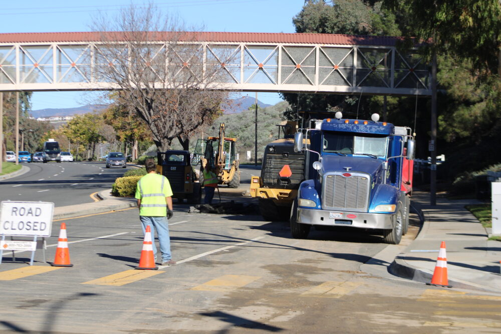 Workers repair the asphalt near the intersection of McBean Parkway and Sunset Hill Drive on Tuesday, Dec. 9, 2025. Susan Monaghan/The Signal