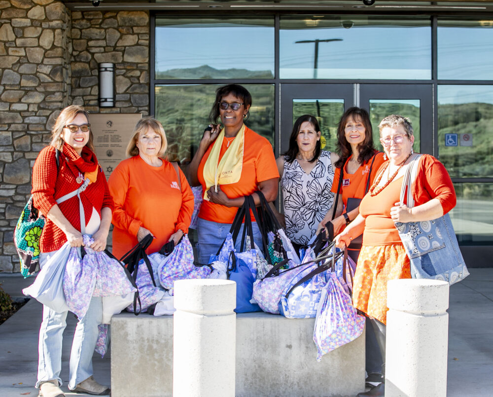 From left: Dinh Montaine, Cathy Gundy, Oriana John, Maria Slotsve, Jackie Howarth, Maria Slotsve and Erika Pigot donate hygiene bags to the Santa Clarita Valley Sheriff's Station on Wednesday, Dec. 10, 2025. Habeba Mostafa/ The Signal