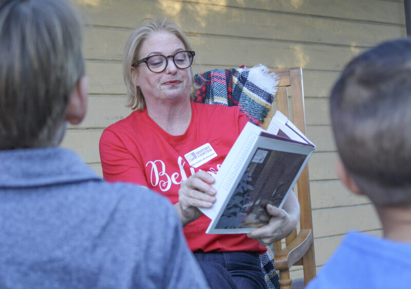 Meredith McGowan, Vice President of the Santa Clarita Valley Historical Society, reads to children during the nonprofit's Polar Express Experience on Saturday, Dec. 9, 2025. Susan Monaghan/The Signal