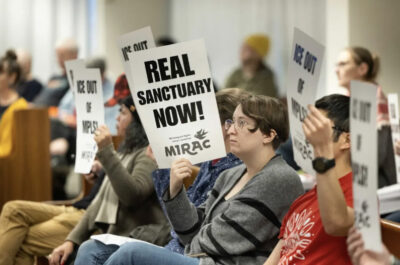 Community members gather for a public hearing as the Minneapolis City Council considers strengthening the city’s separation ordinance barring cooperation with ICE in Minneapolis, Minn., on Dec. 9, 2025. Photo by Jenn Ackerman.