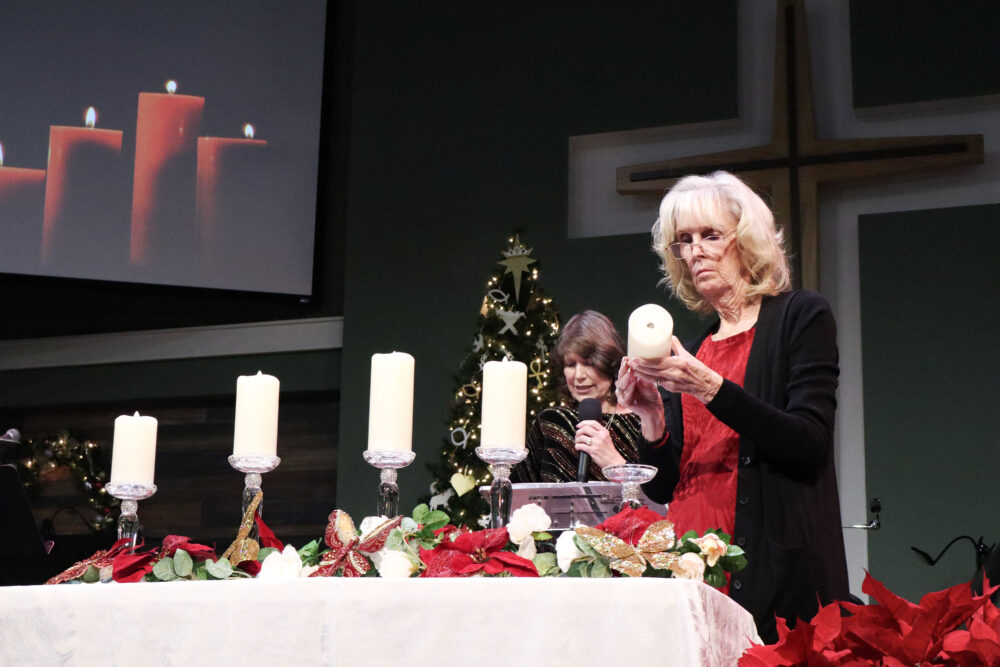 Alice Renolds lights a candle at the Santa Clarita Valley Chapter of Compassionate Friends 24th annual Candlelight Remembrance Program at BethlehemSCV in Canyon Country, Calif., Sunday, Dec. 14, 2025. Kamryn Martell/The Signal