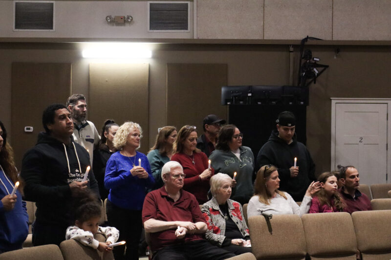 Families and friends light their candles to honor their loved ones at the Santa Clarita Valley Chapter of Compassionate Friends 24th annual Candlelight Remembrance Program at BethlehemSCV in Canyon Country, Calif., Sunday, Dec. 14, 2025. Kamryn Martell/The Signal