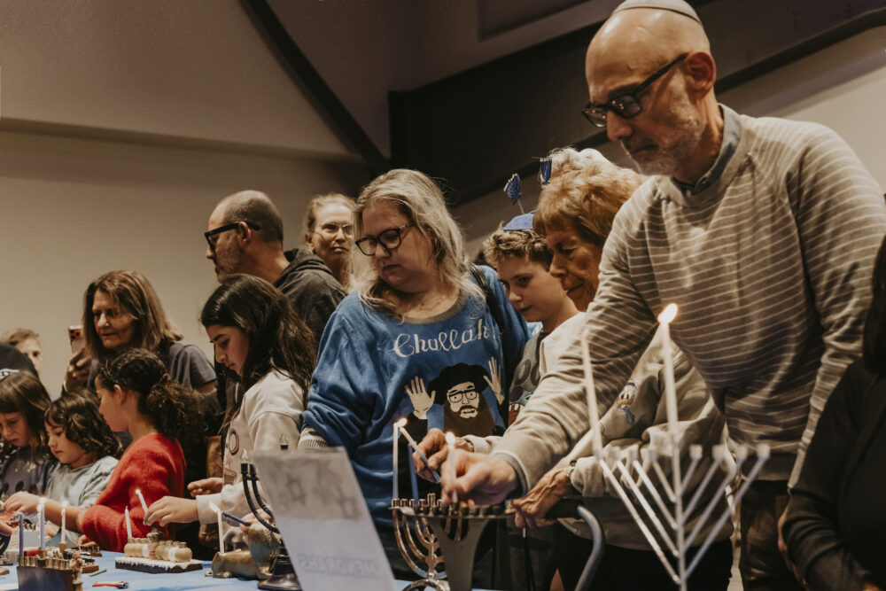 Congregation Beth Shalom hosted a community-wide Hanukkah kick-off party on Sunday night, the first night of Hanukkah. The event featured a menorah lighting, music, latkes and an “ugly Hanukkah sweater” contest. The community’s Hanukkah celebrations continue on the eighth night with the annual community menorah lighting and celebration at 5 p.m. Sunday at the Valencia Town Center mall. Photos courtesy of Congregation Beth Shalom.