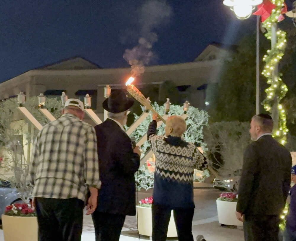 Laurene Weste, mayor of Santa Clarita, helps light the menorah at the Hanukkah at the Mall celebration at Westfield Valencia Town Center in Valencia, Calif., Sunday, Dec. 21, 2025. Kamryn Martell/The Signal