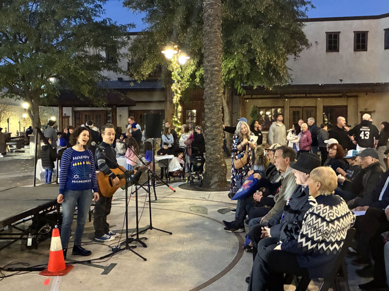Addie Lupert (L) and Rick Lupert (R) sing some songs to the crowd at the Hanukkah at the Mall celebration at Westfield Valencia Town Center in Valencia, Calif., Sunday, Dec. 21, 2025. Kamryn Martell/The Signal