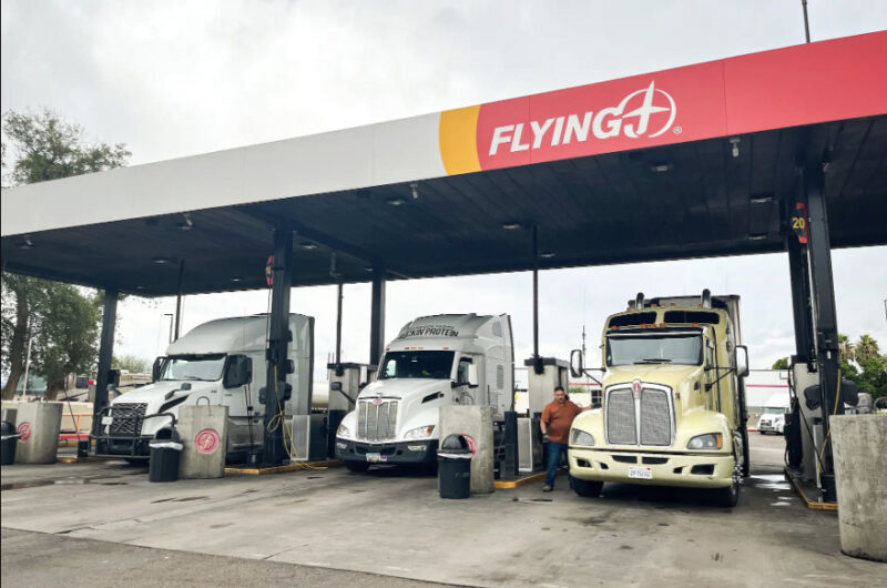 California truck driver Alex Cardona fuels his semi-truck at a Flying J truck stop in Phoenix on Nov. 19, 2025. He said revoking illegally issued truck licenses should make roads safer and open more job opportunities for other drivers. Photo by Allan Stein.