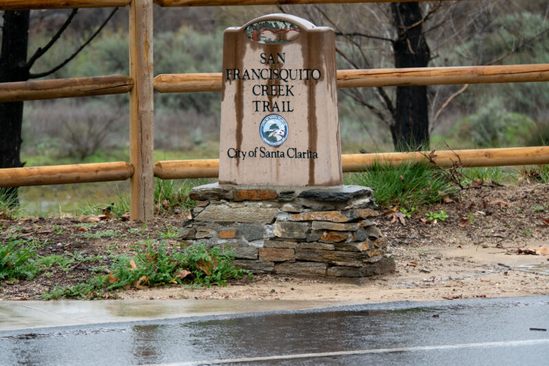 A wet San Francisquito Creek Trail sign following light rain on Wednesday Dec. 31, 2025. Katherine Quezada/The Signal
