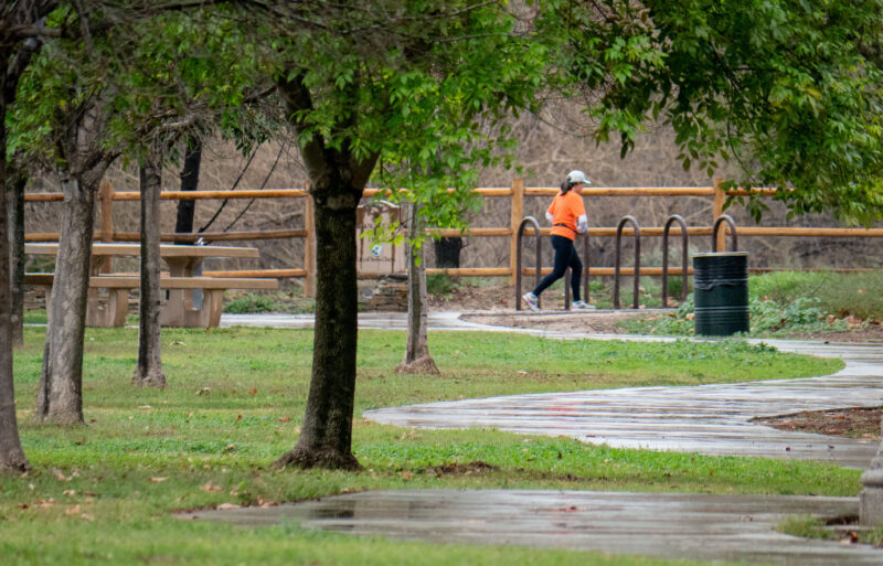 A woman goes for a run in the midst of light rain on Wednesday Dec. 31, 2025. Katherine Quezada/The Signal