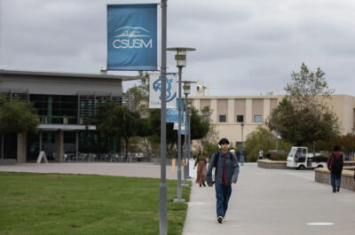 Students walk through campus at Cal State San Marcos on May 6, 2025. Photo by Adriana Heldiz, CalMatters