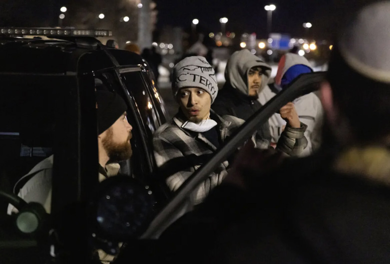 Protestors file a police report against YouTuber Nick Sorter in front of the Bishop Henry Whipple Federal Building in Minneapolis on Jan. 11, 2026. Photo by John Fredricks.