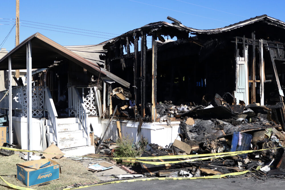 The mobile home sits with the damaged belongings in the front on the 20400 block of Soledad Canyon Road in Canyon Country, Monday, Jan. 12, 2026. Kamryn Martell/The Signal
