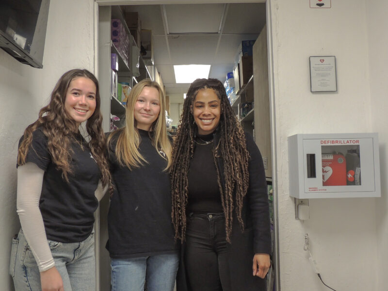 Nessa Santistevan (L), Lucy Elderd (R) and Rachel Compton pose at the Santa Clarita Valley Food Pantry. Photo courtesy of Nessa Santistevan.