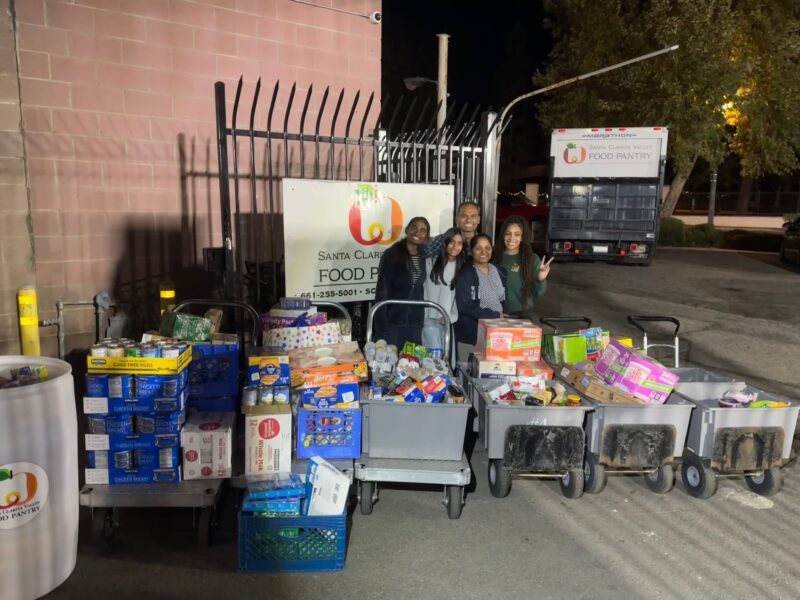 Diya Boini (L) donates food for the Santa Clarita Valley Food Pantry. Photo courtesy of Diya Boini.