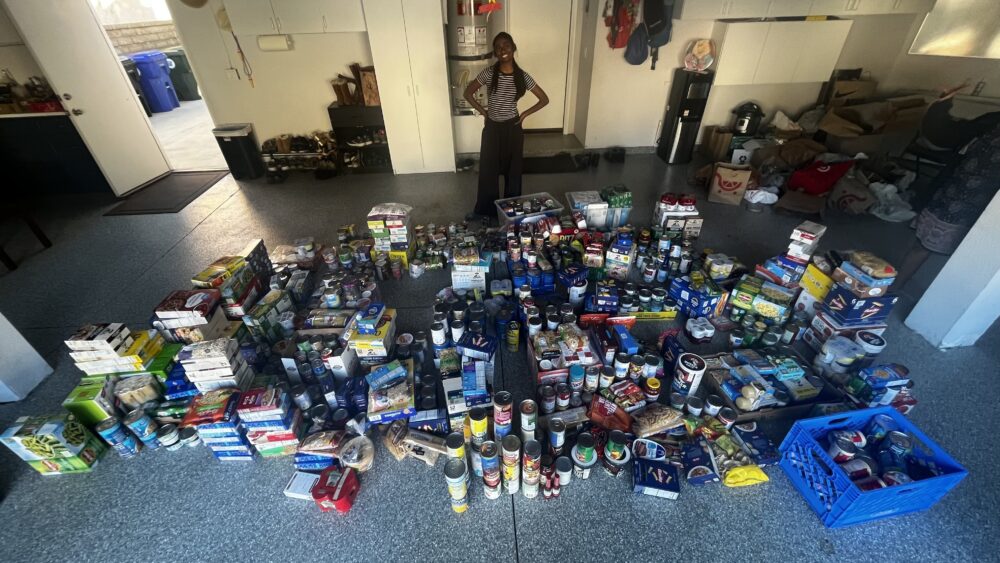 Diya Boini with her donations. Photo courtesy of Diya Boini.