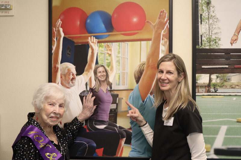 Shirley O'Connell (L) and Erica Sammaciccia (R) smile with a photo that O'Connell pulled a prank on Sammaciccia with at Atria Senior Living in Newhall, Calif., Wednesday, Jan. 14, 2026. Kamryn Martell/The Signal