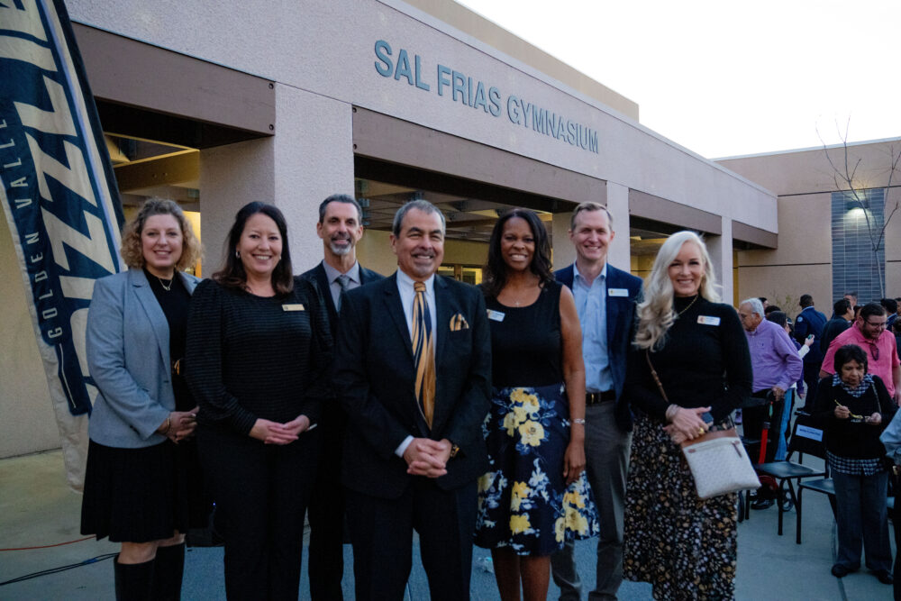 William S. Hart High Union High School District officials with Sal Frias (center) in front of the newly renamed gymnasium at Golden Valley High School on Jan. 16, 2026. Katherine Quezada/The Signal