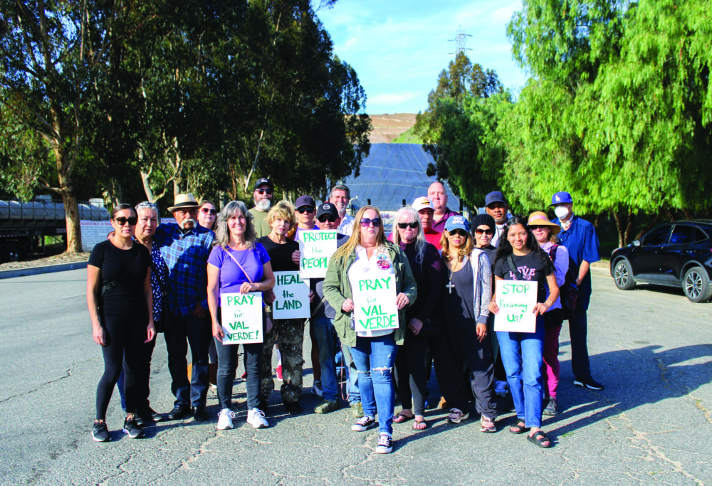 Locals at a prayer circle organized by former Val Verde resident Bill Monroe outside the Chiquita Canyon Landfill. Susan Monaghan/The Signal