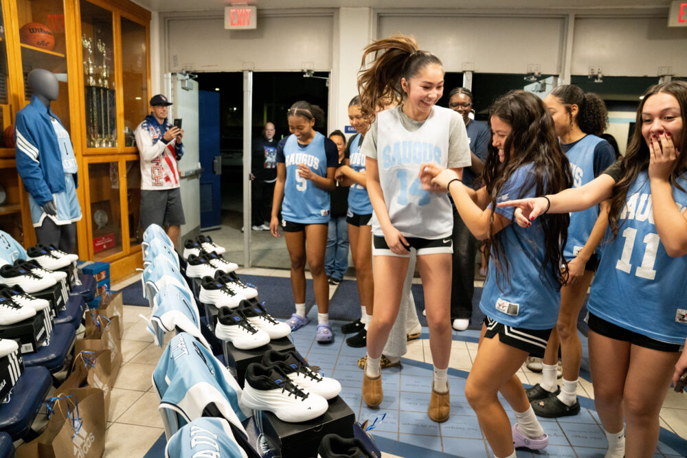 The Saugus girls’ basketball team react to new gear gifted by Adidas following their practice on Wednesday Jan. 14, 2026. Katherine Quezada/The Signal