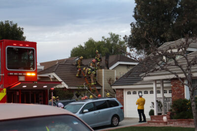 Los Angeles County Fire Department personnel works to extinguish a chimney fire on the 26000 block of Moreno Drive in Valencia, Sunday, Jan. 25, 2025. Kamryn Martell/The Signal