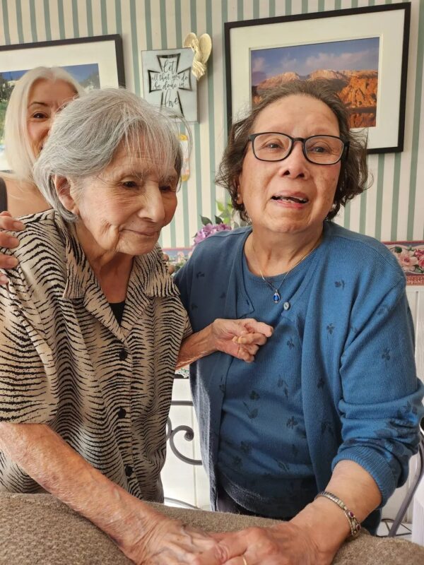 Alice Sumner (R) poses with her sister Betty, 102, at her party. Photo courtesy of Jeffrey Tucker.