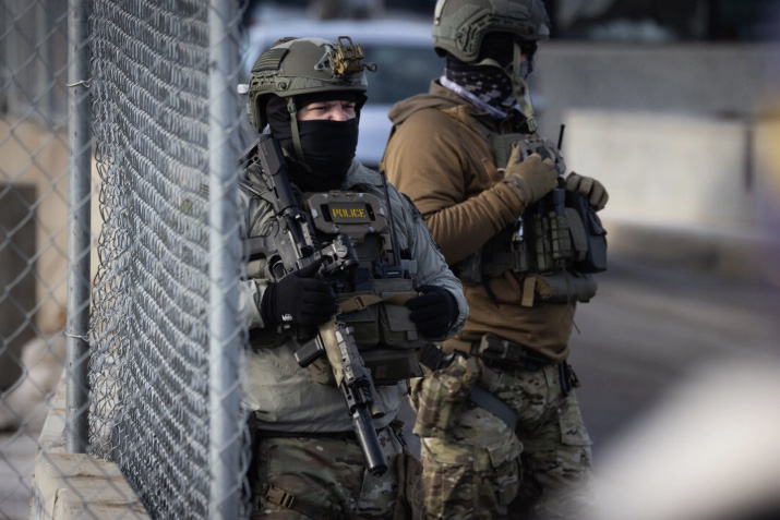 Immigration and Customs Enforcement (ICE) agents confront protesters in front of the Bishop Henry Whipple Federal Building in Minneapolis, Minn., on Jan. 12, 2026. Photo by John Fredricks.