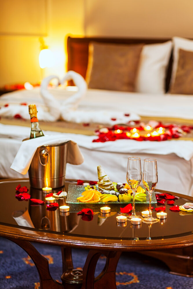 Enjoy a romantic getaway. Bring along your favorite champagne and chocolate-covered strawberries, toss rose petals on the bed and order room service. ©ADOBESTOCK