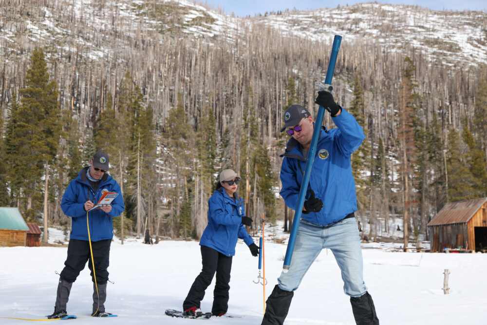 The California Department of Water Resources (from left) Snow Survey and Water Supply Forecasting Unit Manager Andy Reising, Hydrometerologist Angelique Fabbiani-Leon and Engineer Jacob Kollen conduct the second media snow survey of the 2026 season at Phillips Station in the Sierra Nevada. The snow survey is held approximately 90 miles east of Sacramento off Highway 50 in El Dorado County. Photo taken January 30, 2026.