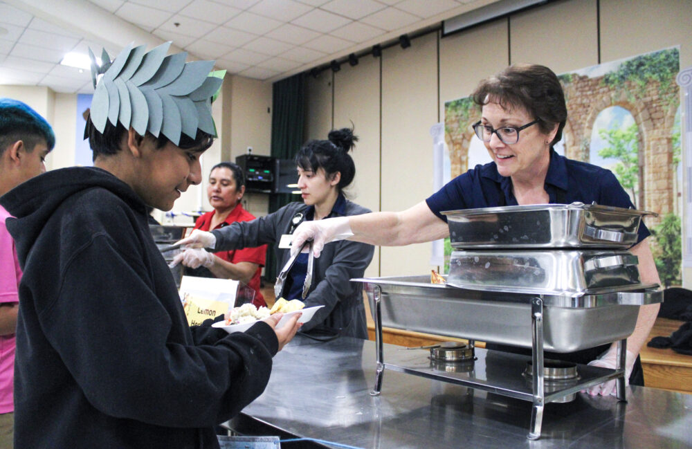 Sixth grader Adriel Bastian takes a lemony potato in the buffet line for a Greek lunch his class prepared on Friday, Feb. 6, 2026. Susan Monaghan/The Signal