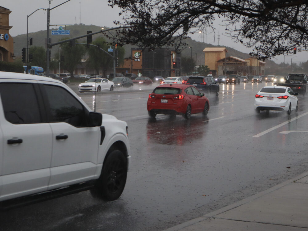 Cars drive in the rain on Newhall Ranch Road and Bouquet Canyon Road on Monday, Feb. 16, 2026. Kamryn Martell/The Signal