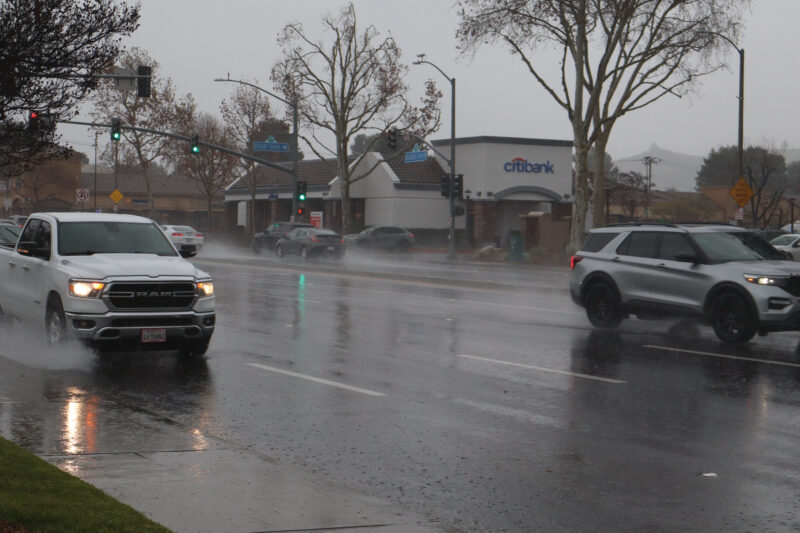 Cars drive through the rain on the intersection of Newhall Ranch Road and Bouquet Canyon Road, Monday, Feb. 16, 2026. Kamryn Martell/The Signal