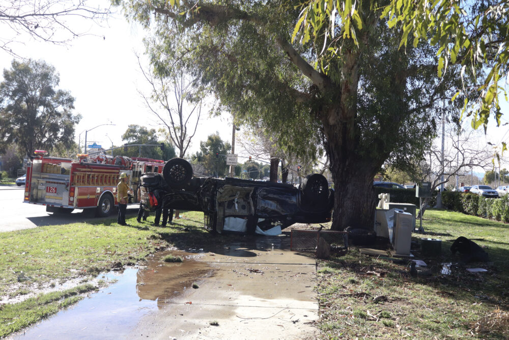 The black GMC endures a traffic collision and gets overturned on Valencia Boulevard between McBean Parkway and Citrus Street, Monday, Feb. 23, 2026. Kamryn Martell/The Signal