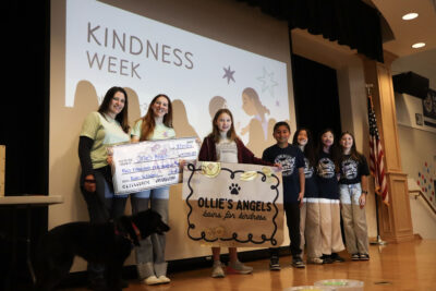 Ollie's Angels and Oak Hills Elementary School students smile for the camera at a school assembly, Tuesday, Feb. 24, 2026, Kamryn Martell/The Signal