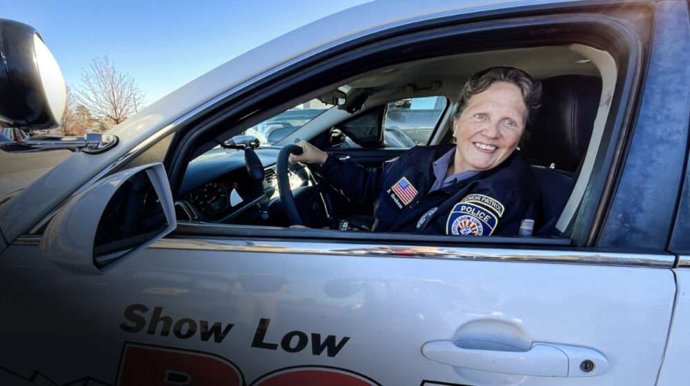 Beverly Graham, a member of the Senior Patrol, sits behind the wheel of her police cruiser in Show Low, Ariz., on Feb. 4, 2026. Photo by Allan Stein.