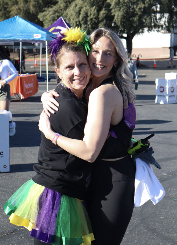 Sharlene Johnson, co-chair of "Mardi Gras Madness," and Brittany Barlog smile for the camera at JCI Santa Clarita's 16th annual "Mardi Gras Madness" 5K and 10K at Valencia Town Center, Sunday, March 1, 2026. Kamryn Martell/The Signal