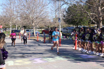 Runners head to the finish line at JCI Santa Clarita's 16th annual "Mardi Gras Madness" 5K and 10K at Valencia Town Center, Sunday, March 1, 2026. Kamryn Martell/The Signal