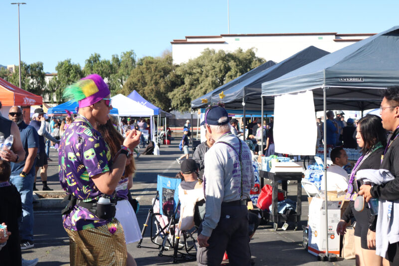 Attendees enjoy the booths at JCI Santa Clarita's 16th annual "Mardi Gras Madness" 5K and 10K at Valencia Town Center, Sunday, March 1, 2026. Kamryn Martell/The Signal