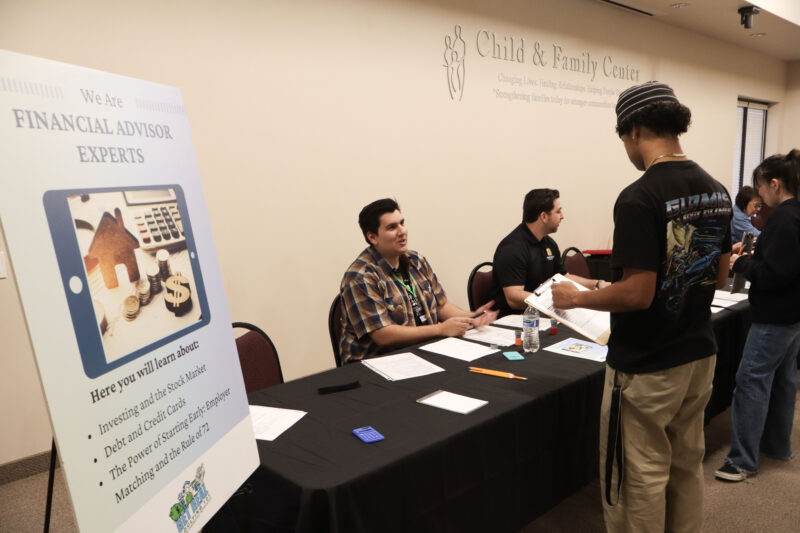 Mack Herrera helps a Bowman High School student with financial advising at the JCI Santa Clarita's "Get Real: Adulting 101" financial literacy event at Child & Family Center in Canyon Country, Calif., Wednesday, March 4, 2026. Kamryn Martell/The Signal