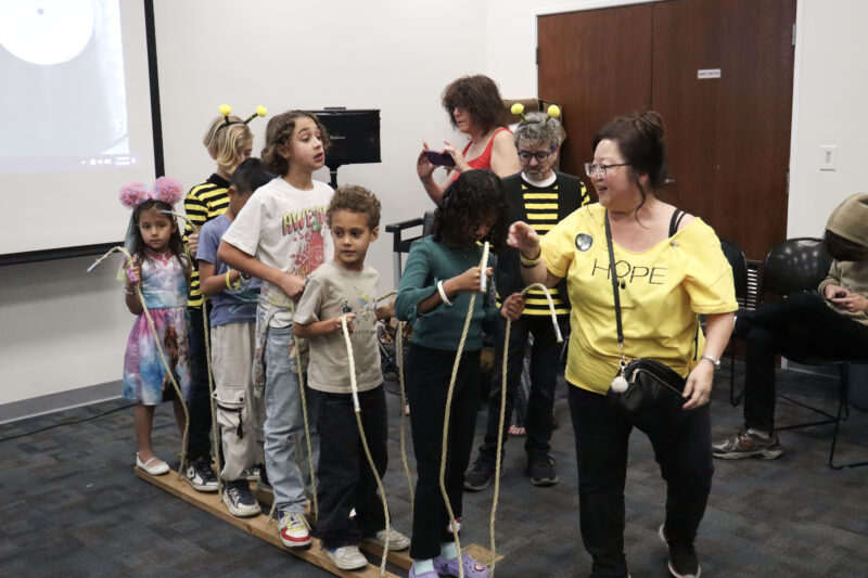 Children work in a team to move the wooden block skis at the 5th annual Hope Theatre Arts event at the Canyon Country Jo Anne Darcy Library in Canyon Country, Calif., Sunday, March 8, 2026. Kamryn Martell/The Signal