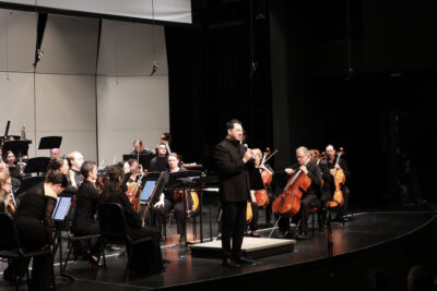 Martin Alexander Arellano, conductor, speaks to audience about the program at the Santa Clarita Symphony Orchestra's "Dreams and Destinies" concert at Canyon High School in Canyon Country, Calif., Sunday, March 8, 2026. Kamryn Martell/The Signal